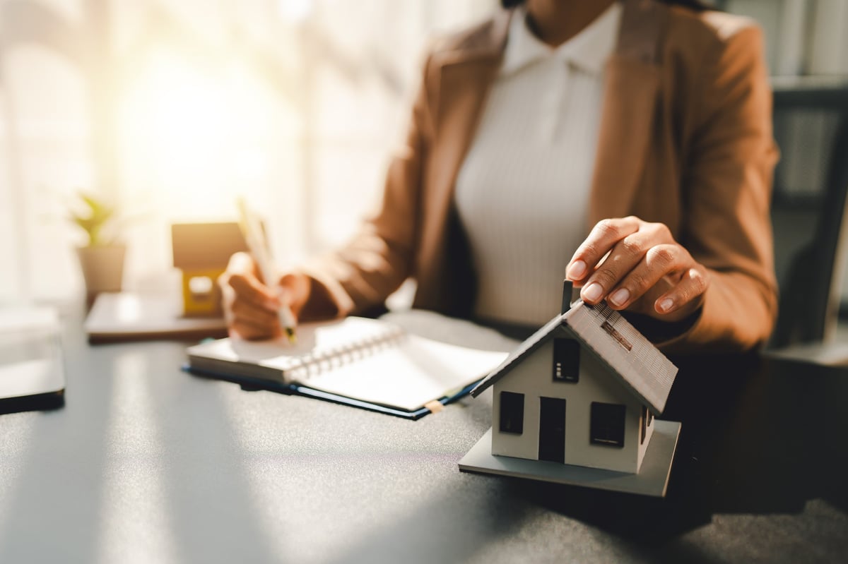 Reviewing lease and home agreements at a desk
