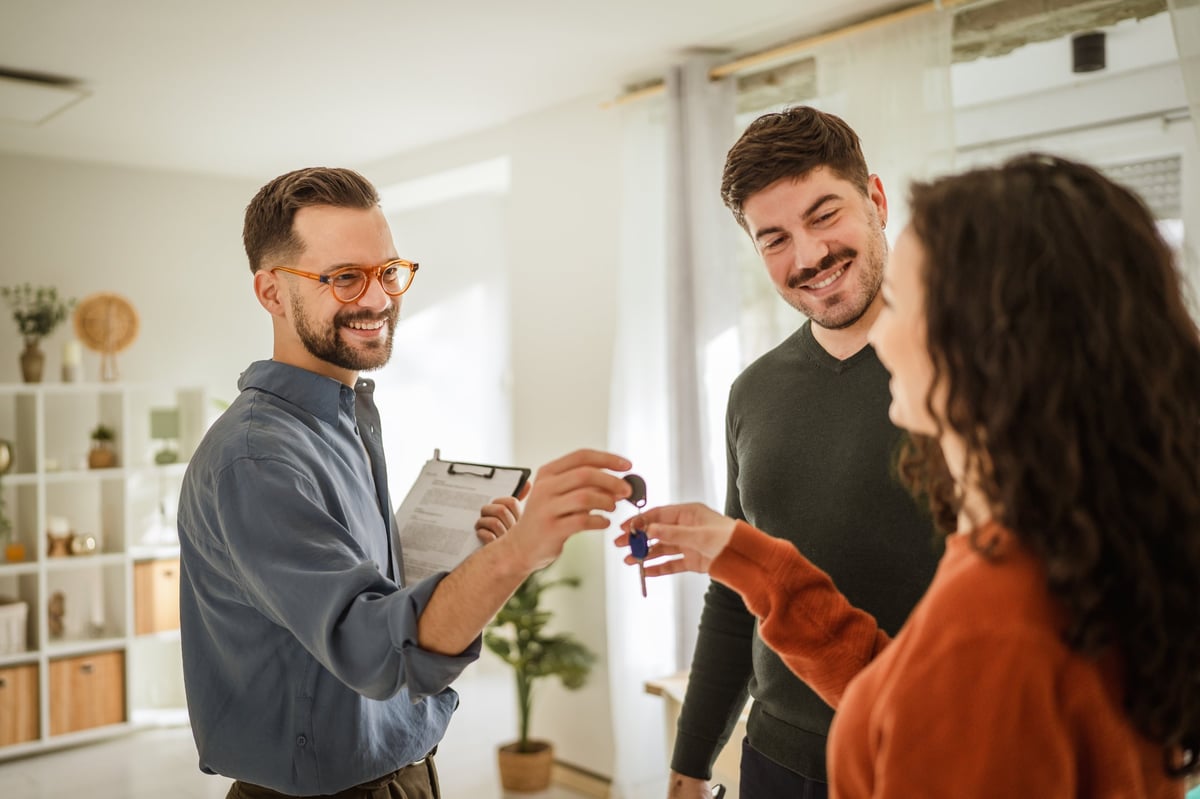 Residents receiving keys to their new apartment